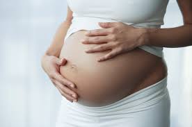 pregnant woman's belly, older hands