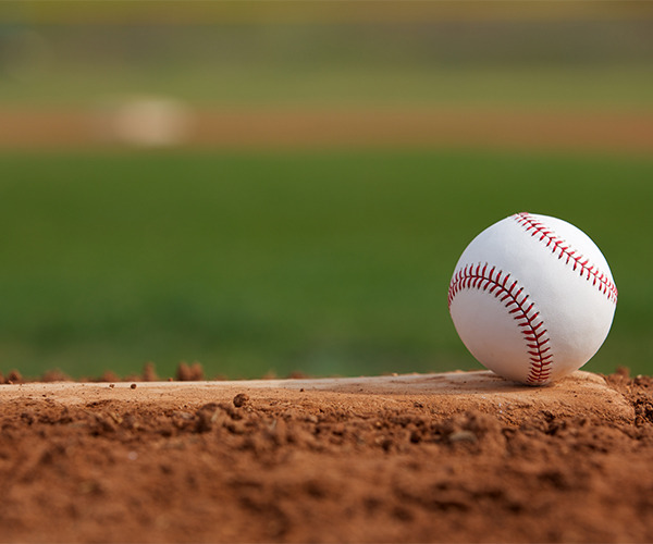 closeup of a baseball on grass