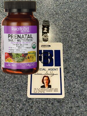 Scully's FBI badge and a bottle of prenatal vitamins