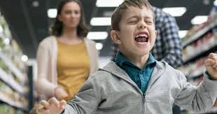 grocery store. boy screaming, parents upset